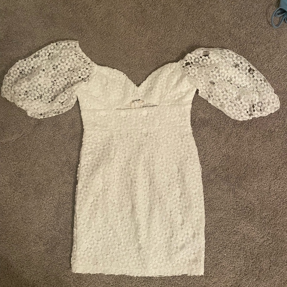 Elegant white lace dress with beautiful puff sleeves